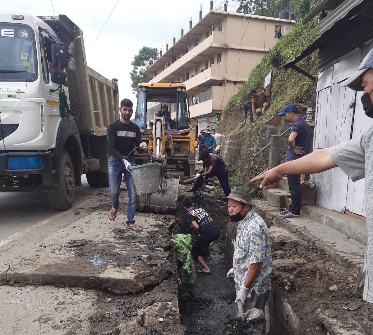 Residents of the Naga Hospital Colony Kohima cleaning drainages during the mass social service in the colony on May 11, 2024.