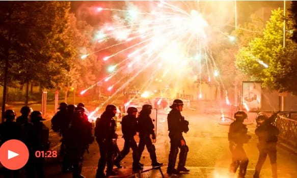 France riots: more than 400 arrested as police officer accused of shooting teen apologises