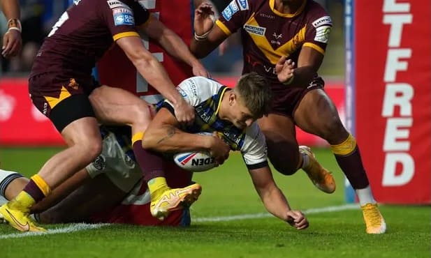 Leeds mark emotional night with ruthless demolition of Huddersfield